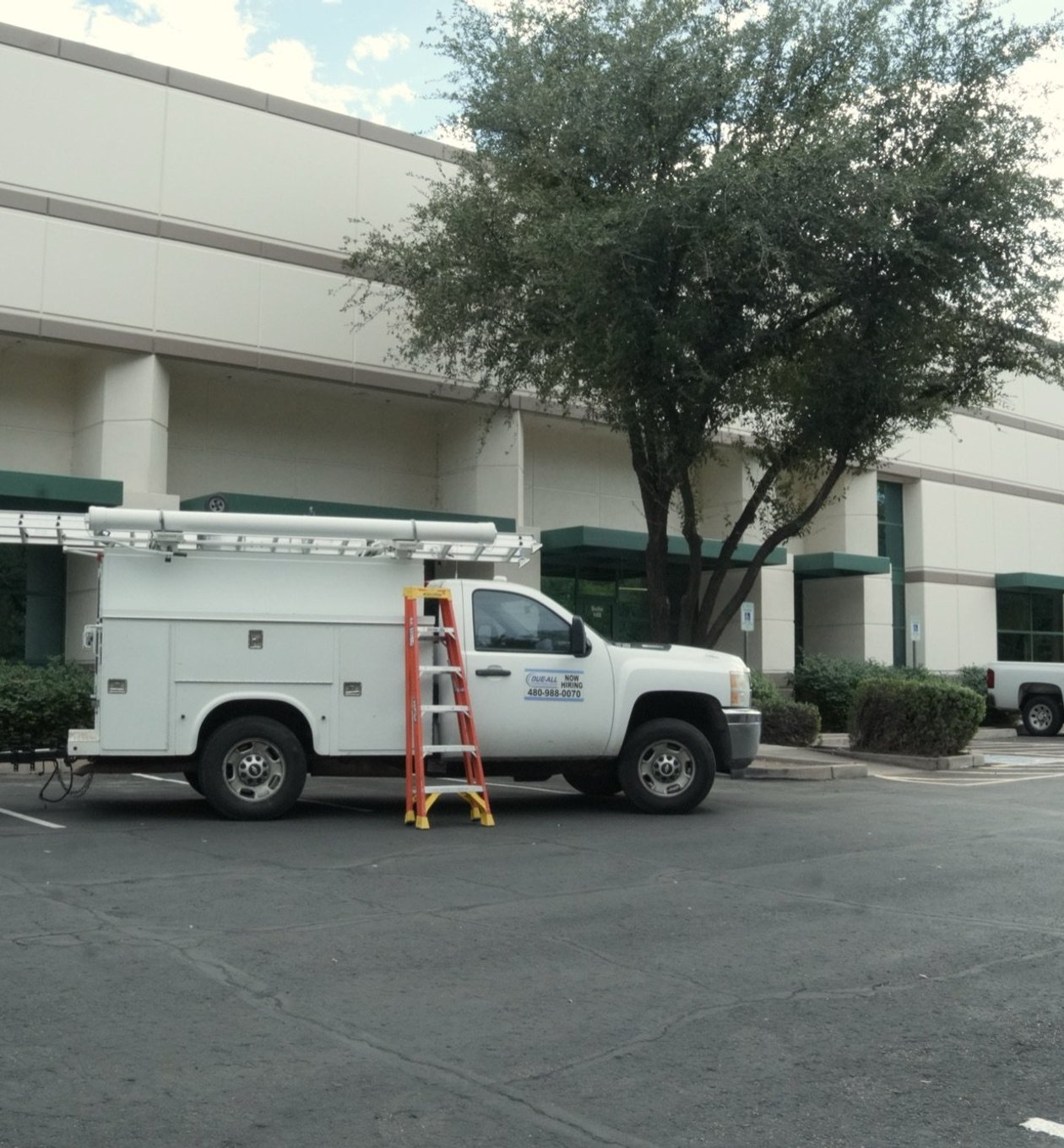 Due-All service truck at a commercial office park