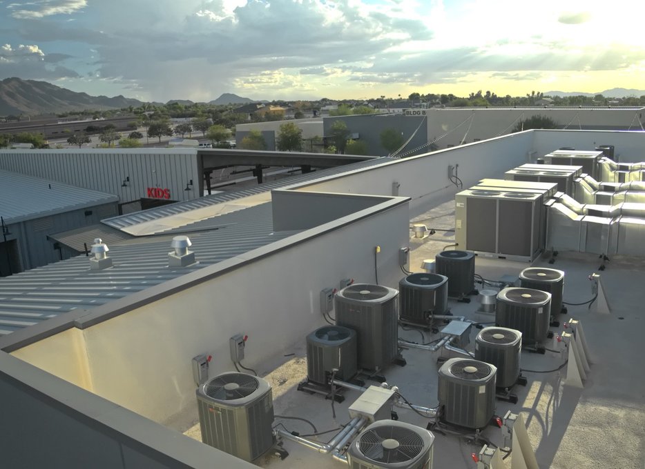 Rooftop condensers and package units on a new East Valley commercial building