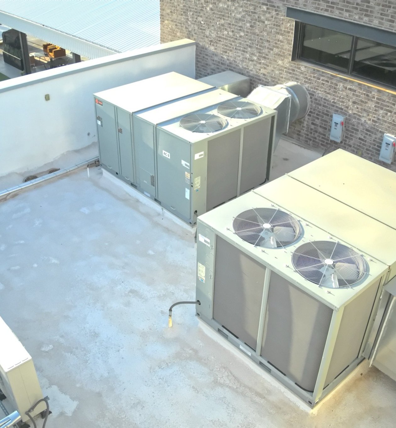 Rooftop package units and condensers on a commercial office building